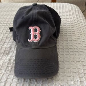Boston Red Sox hat. The B is pink the hat is navy blue vintage wash.